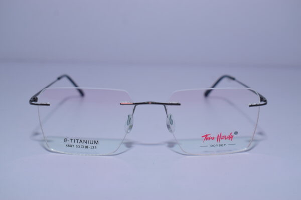 Tom Hardy Frameless Odysey Eye Wear metal frame