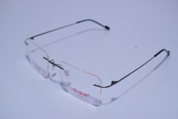 Tom Hardy Frameless Odysey Eye Wear metal frame